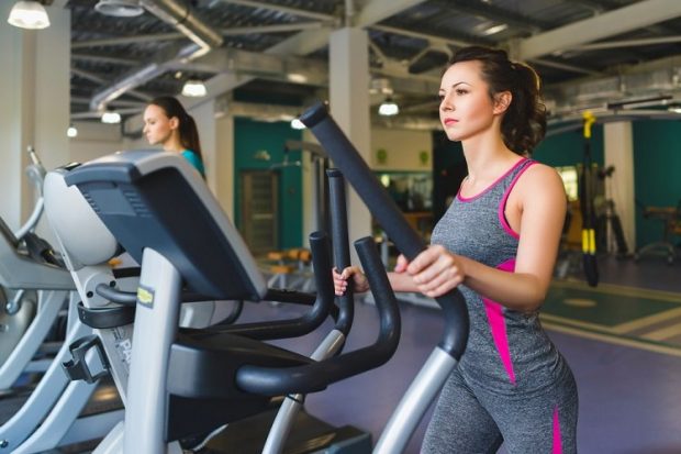 woman on cross trainer
